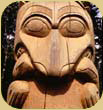 Totem pole depicting bear with salmon.